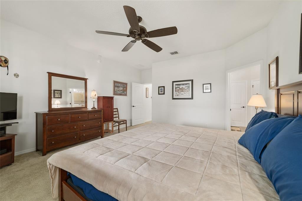 6479 Southwest 94th Circle Ocala, FL 34481 - Photo 35 of 82 a bedroom with a bed and a dresser