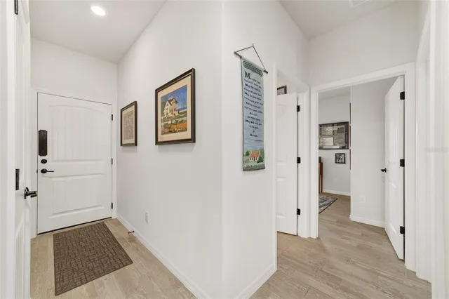 an aerial view of residential houses with outdoor space and swimming pool