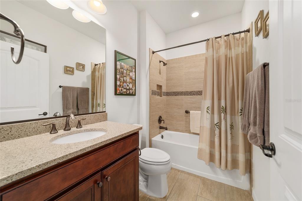6479 Southwest 94th Circle Ocala, FL 34481 - Photo 46 of 82 a bathroom with a granite countertop sink toilet and shower