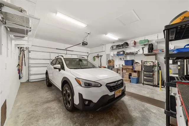 an aerial view of a residential houses with outdoor space