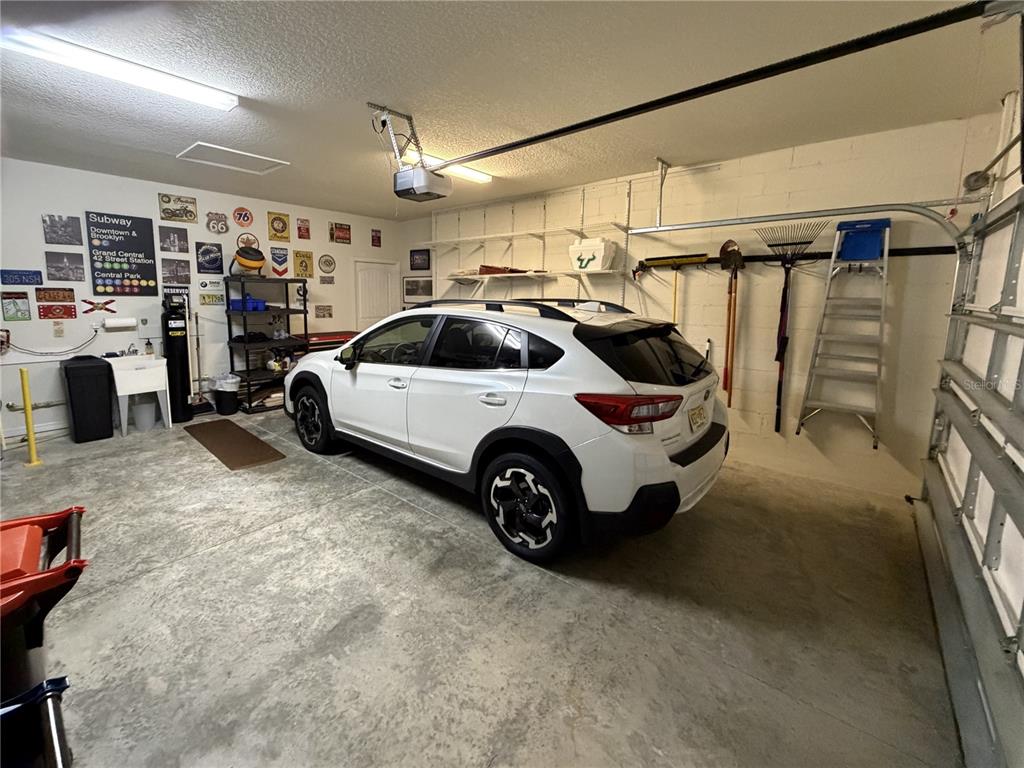 6479 Southwest 94th Circle Ocala, FL 34481 - Photo 53 of 82 a view of parking garage with cars and other equipment