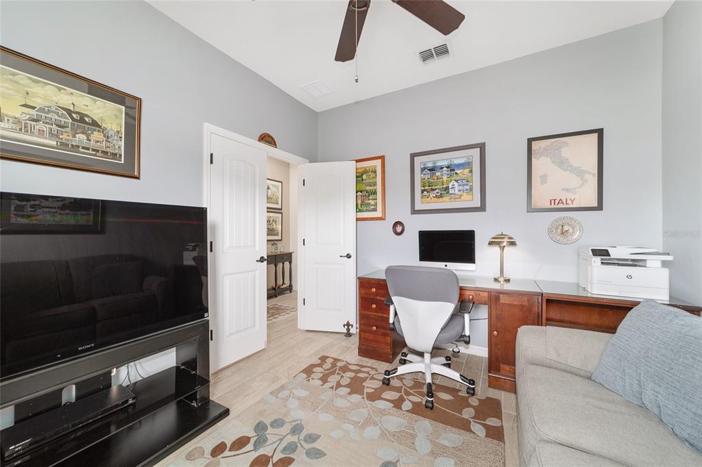 6479 Southwest 94th Circle Ocala, FL 34481 - Photo 55 of 82 a view of a livingroom with workspace and a couch