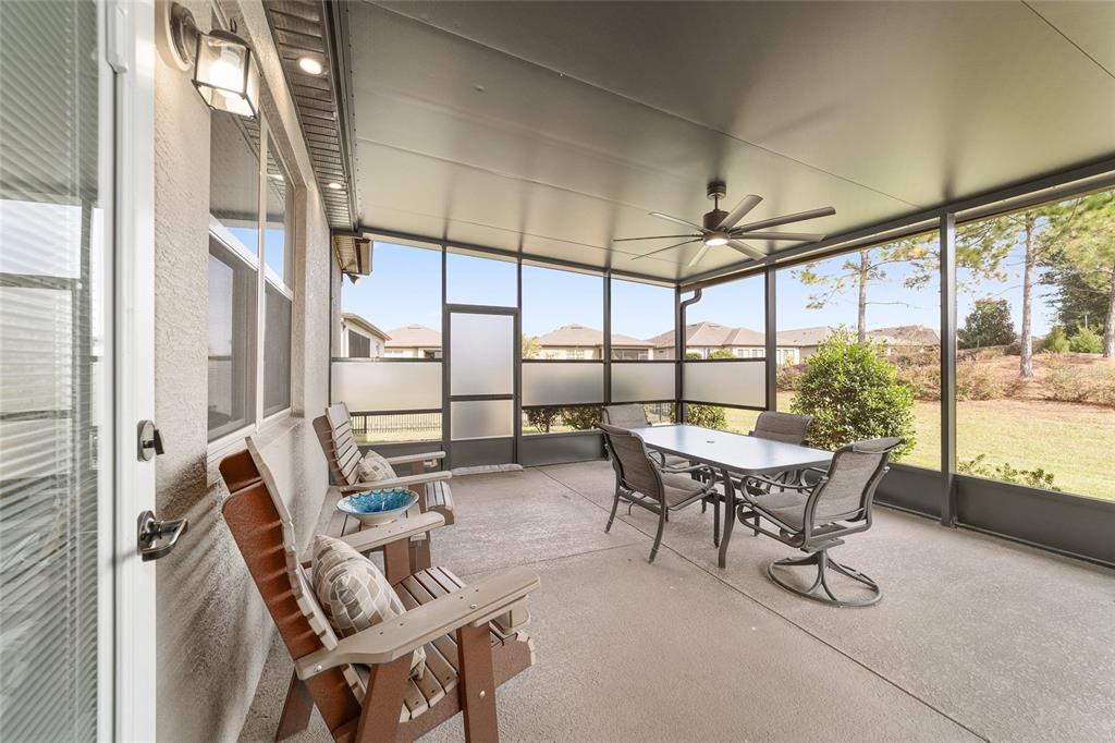 6479 Southwest 94th Circle Ocala, FL 34481 - Photo 57 of 82 a dining room with furniture and large windows
