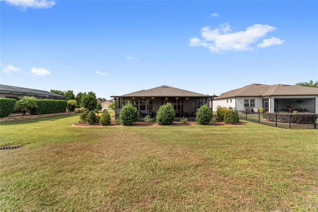 6479 Southwest 94th Circle Ocala, FL 34481 - Photo 63 of 82 a front view of house with yard and patio