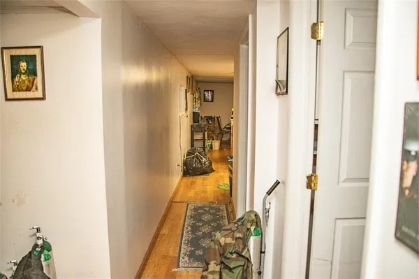 a view of a hallway with a living room