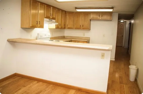 a kitchen with a sink and a refrigerator