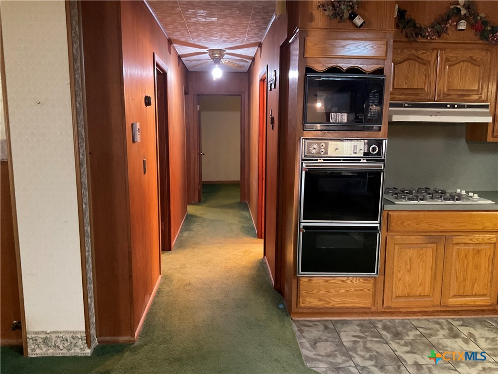 404 Svoboda Street Yoakum, TX 77995 - Photo 12 of 20 a view of a kitchen from the hallway