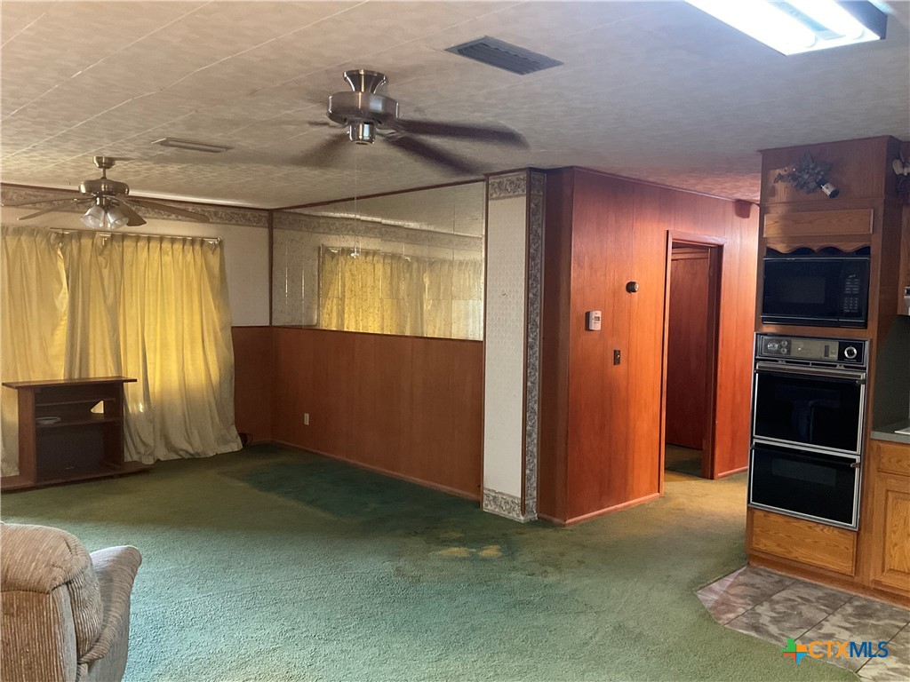 404 Svoboda Street Yoakum, TX 77995 - Photo 13 of 20 wooden floor and windows in a room