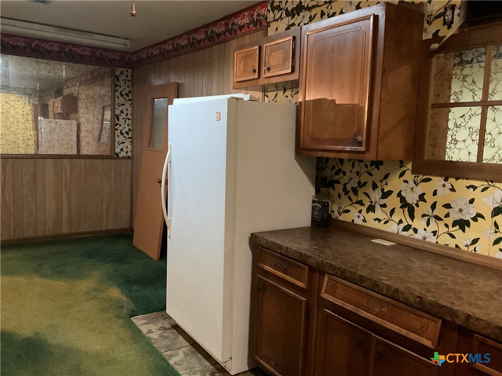 404 Svoboda Street Yoakum, TX 77995 - Photo 16 of 20 a view of a refrigerator in kitchen