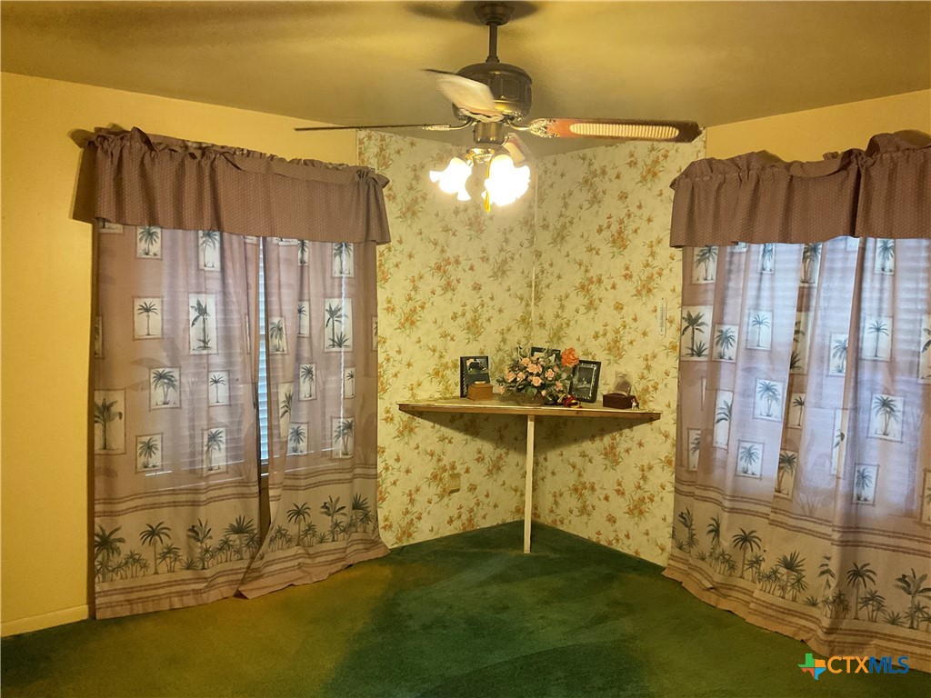 404 Svoboda Street Yoakum, TX 77995 - Photo 6 of 20 a view of a bathroom with a shower curtain