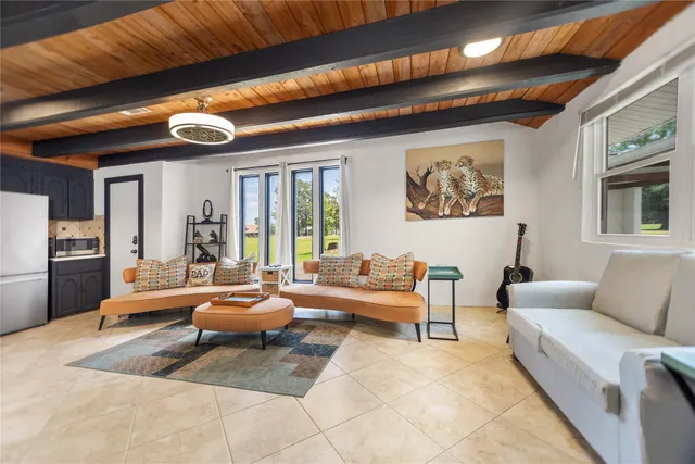 a bedroom with furniture and a flat screen tv
