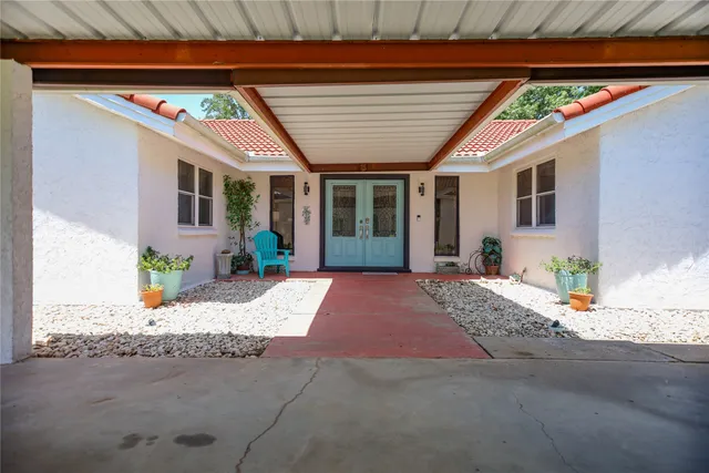 a front view of a house with a sitting space
