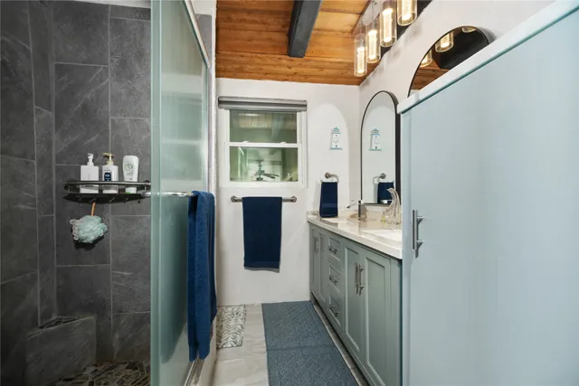 a bedroom with a bed couch and window