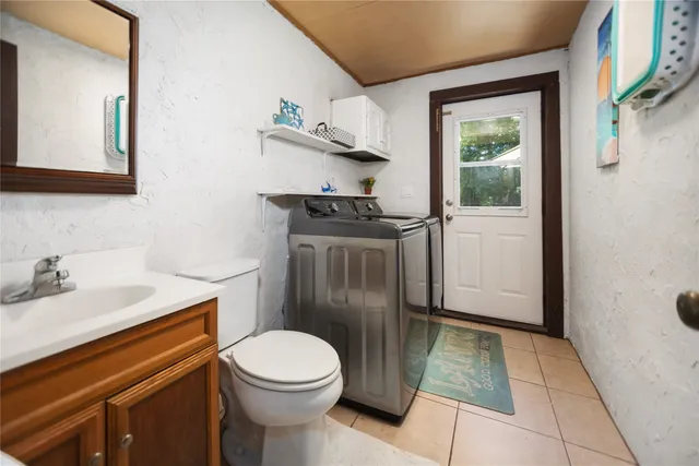 a living room with fireplace furniture and a floor to ceiling window