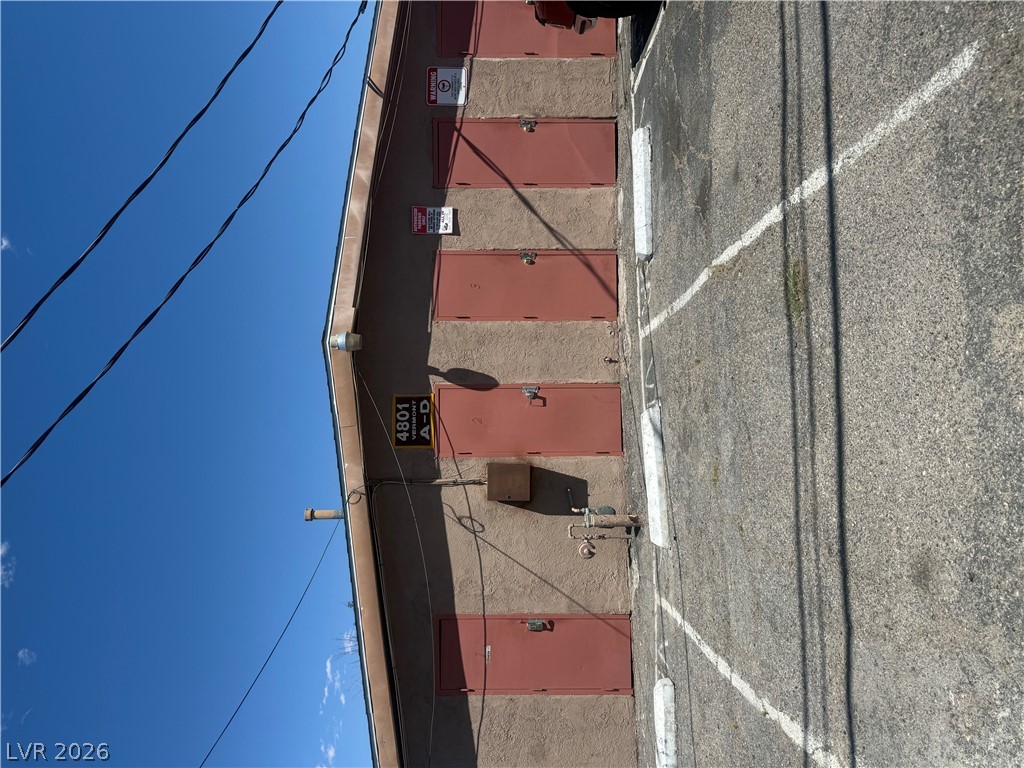 521 North Decatur Boulevard, Unit B Las Vegas, NV 89107 - Photo 17 of 17 Functional garage spaces with convenient parking access and clear directional signage.