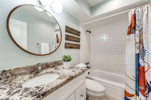 a bedroom with bed and a window