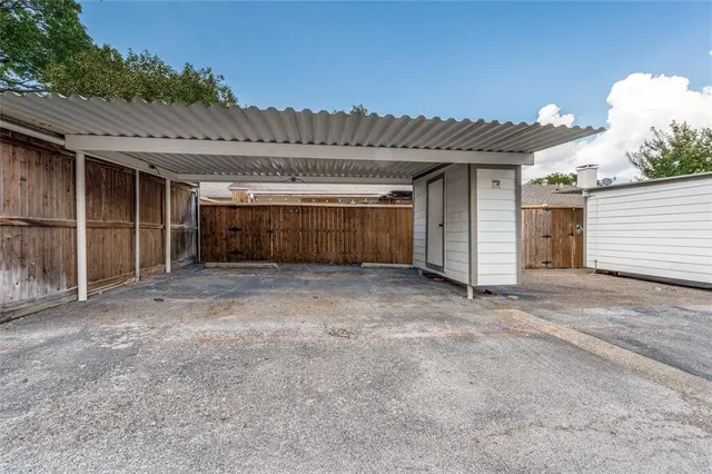 a view of a porch with a table and chairs