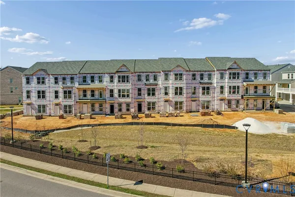 a view of a swimming pool with outdoor seating
