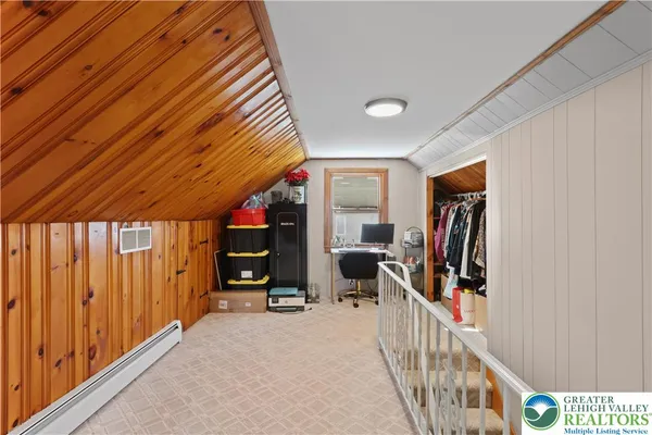 a view of a hallway with furniture