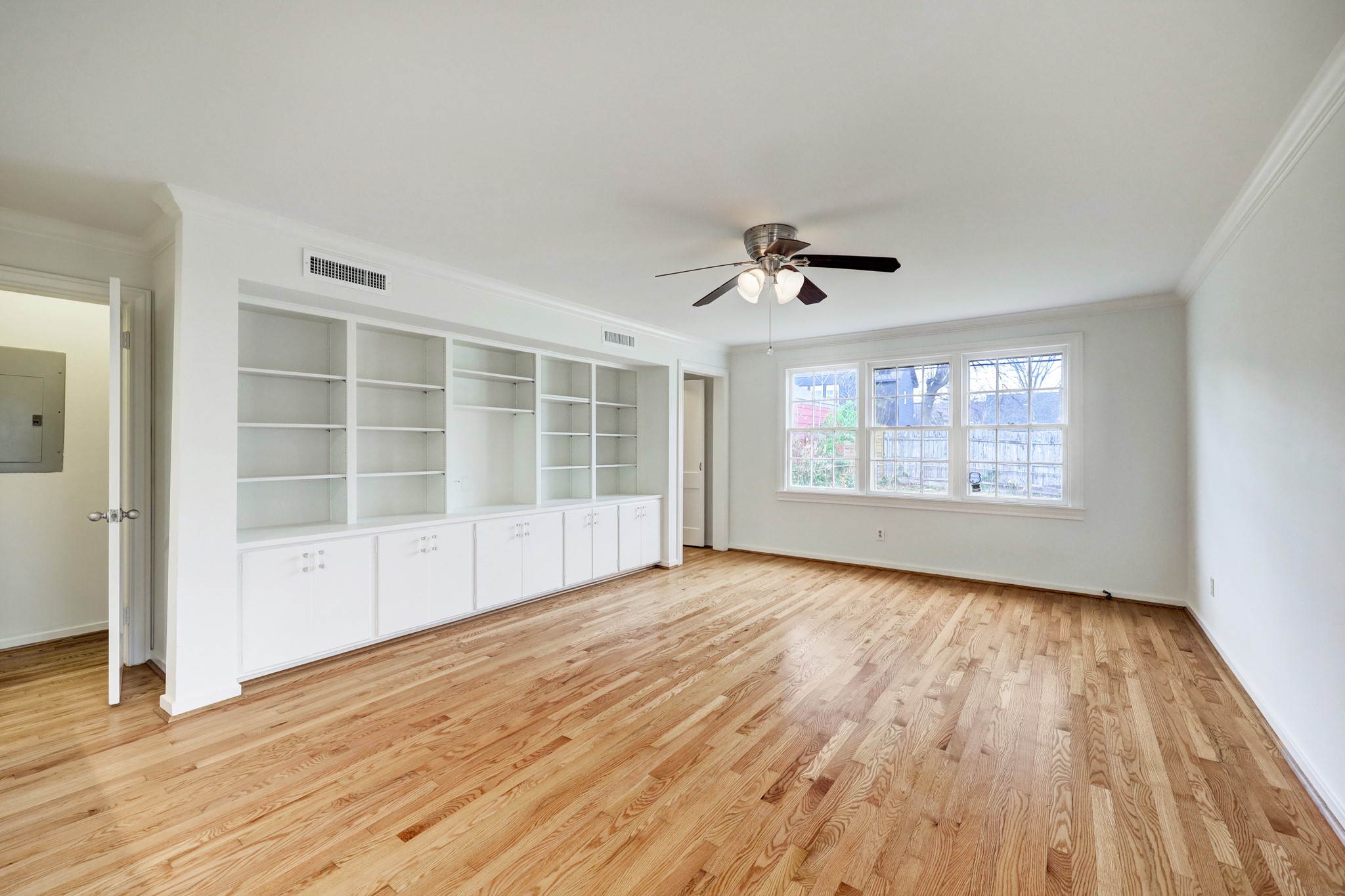 1950 Lexington Street Houston, TX 77098 - Photo 7 of 16 Towards the back of the home, you will find the informal living space with a dry bar to the kitchen area, powder bath, and a second stair-well to the second floor.