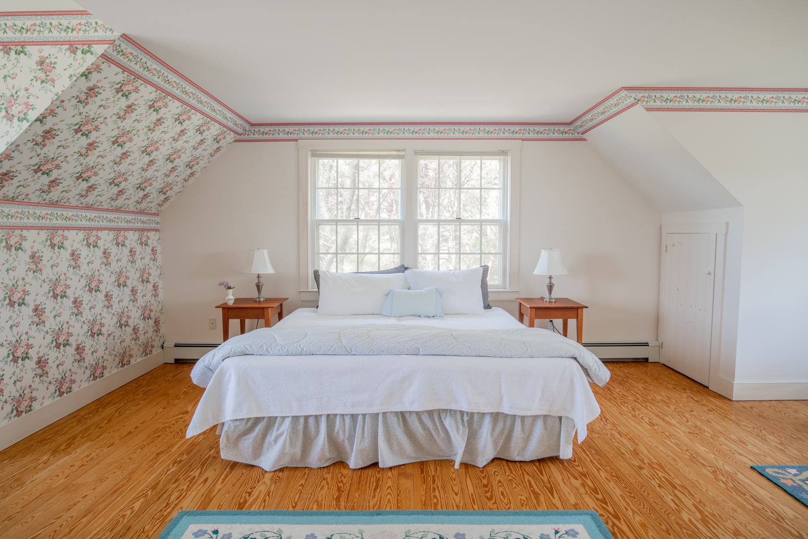 15 Swift Rock Road Nantucket, MA 02554 - Photo 27 of 32 a bedroom with a bed and wooden floor