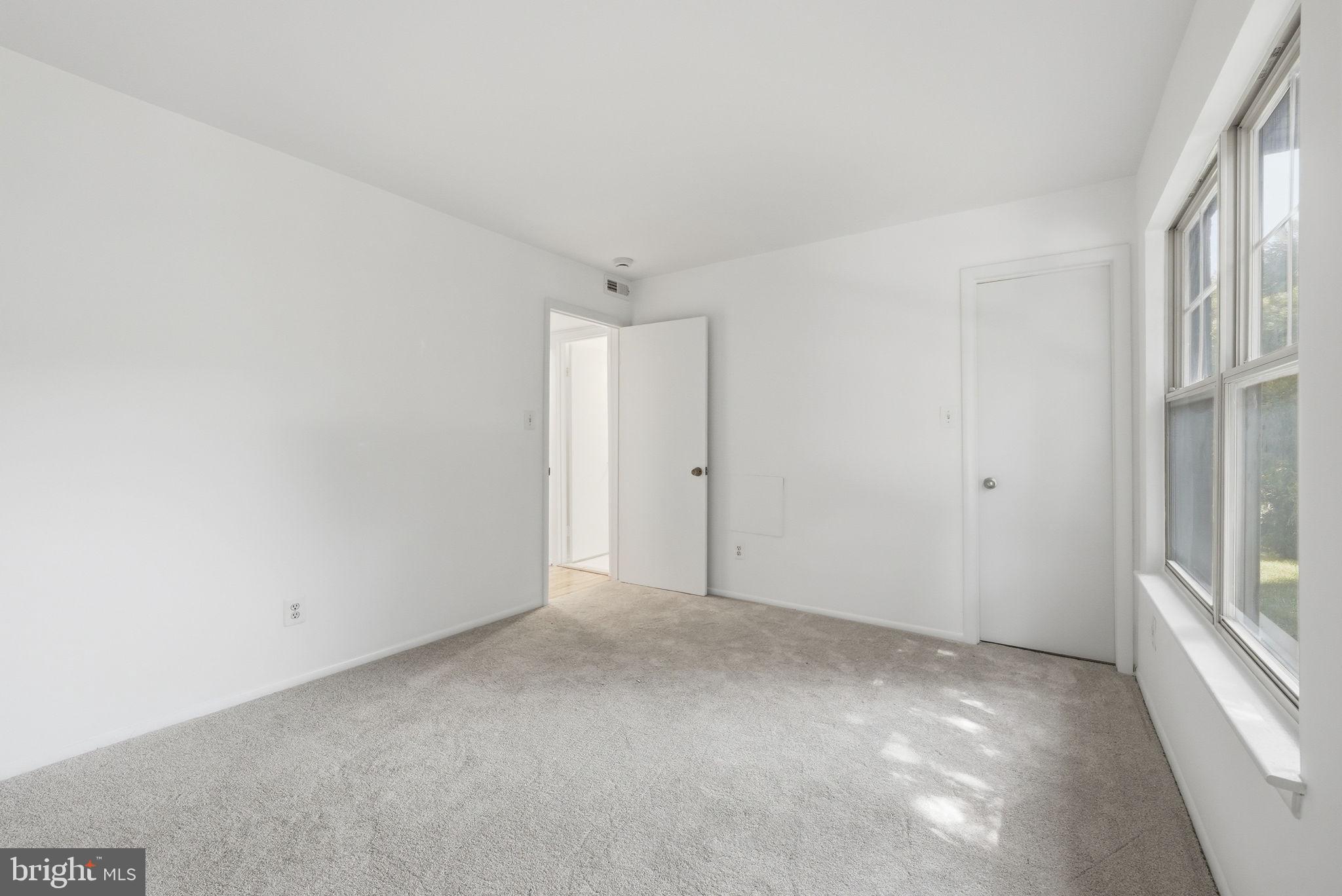 1703 Ascot Way, Unit D Reston, VA 20190 - Photo 16 of 21 a view of an empty room with a window