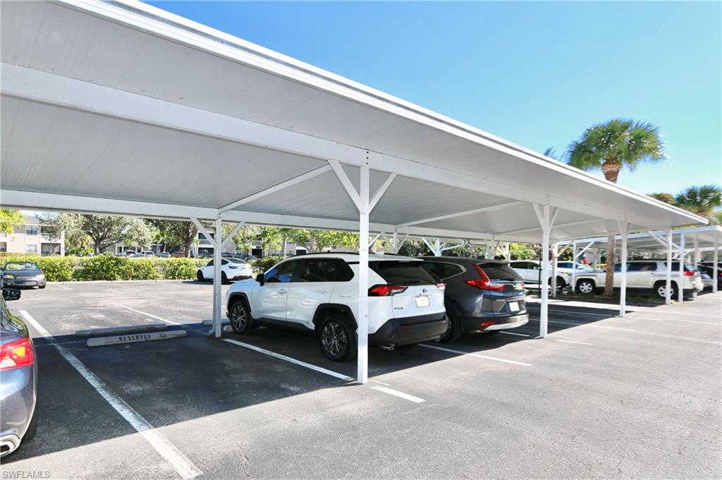 481 Quail Forest Boulevard, Unit B206 Naples, FL 34105 - Photo 14 of 16 a view of a parking garage