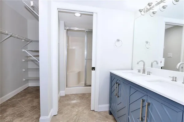 a bathroom with a sink a vanity and a mirror