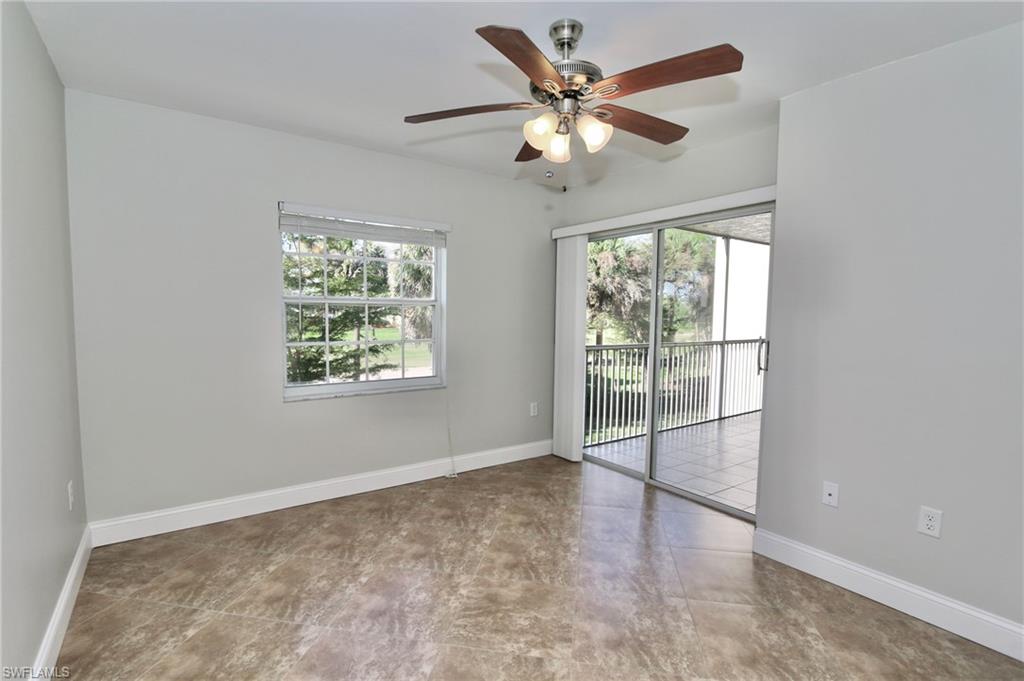 481 Quail Forest Boulevard, Unit B206 Naples, FL 34105 - Photo 10 of 16 an empty room with windows and fan