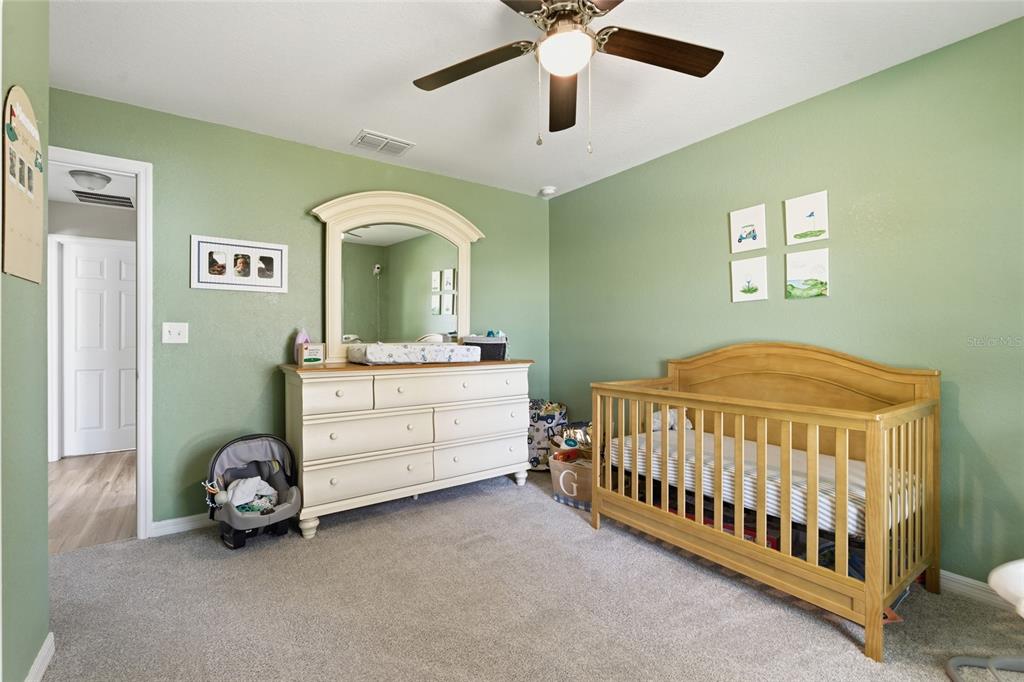 13880 Southwest 45th Terrace Ocala, FL 34473 - Photo 11 of 19 a bedroom with a bed and a table