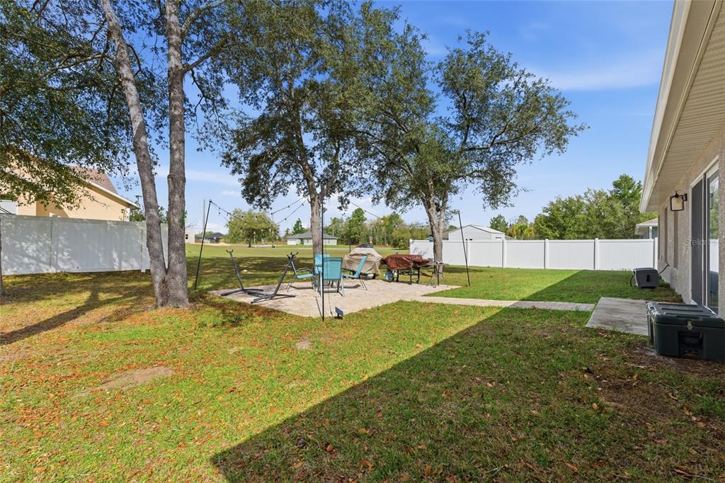 13880 Southwest 45th Terrace Ocala, FL 34473 - Photo 16 of 19 a view of a backyard with swimming pool