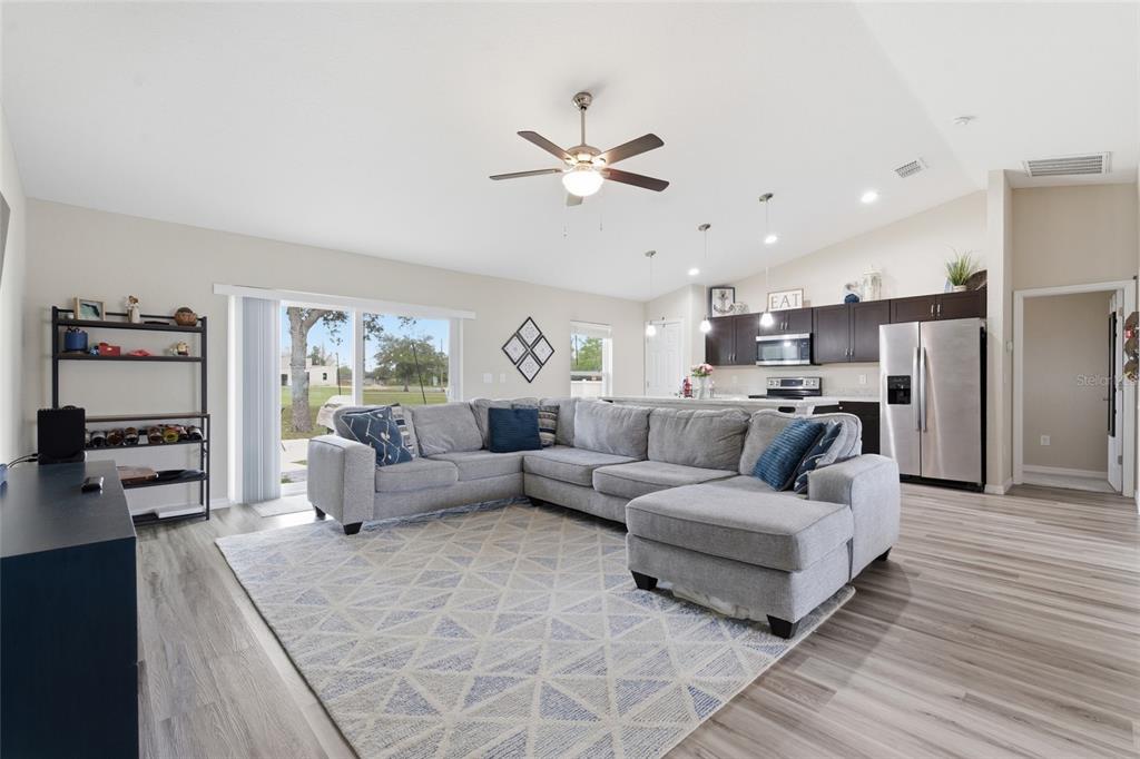 13880 Southwest 45th Terrace Ocala, FL 34473 - Photo 5 of 19 a living room with furniture and a large window
