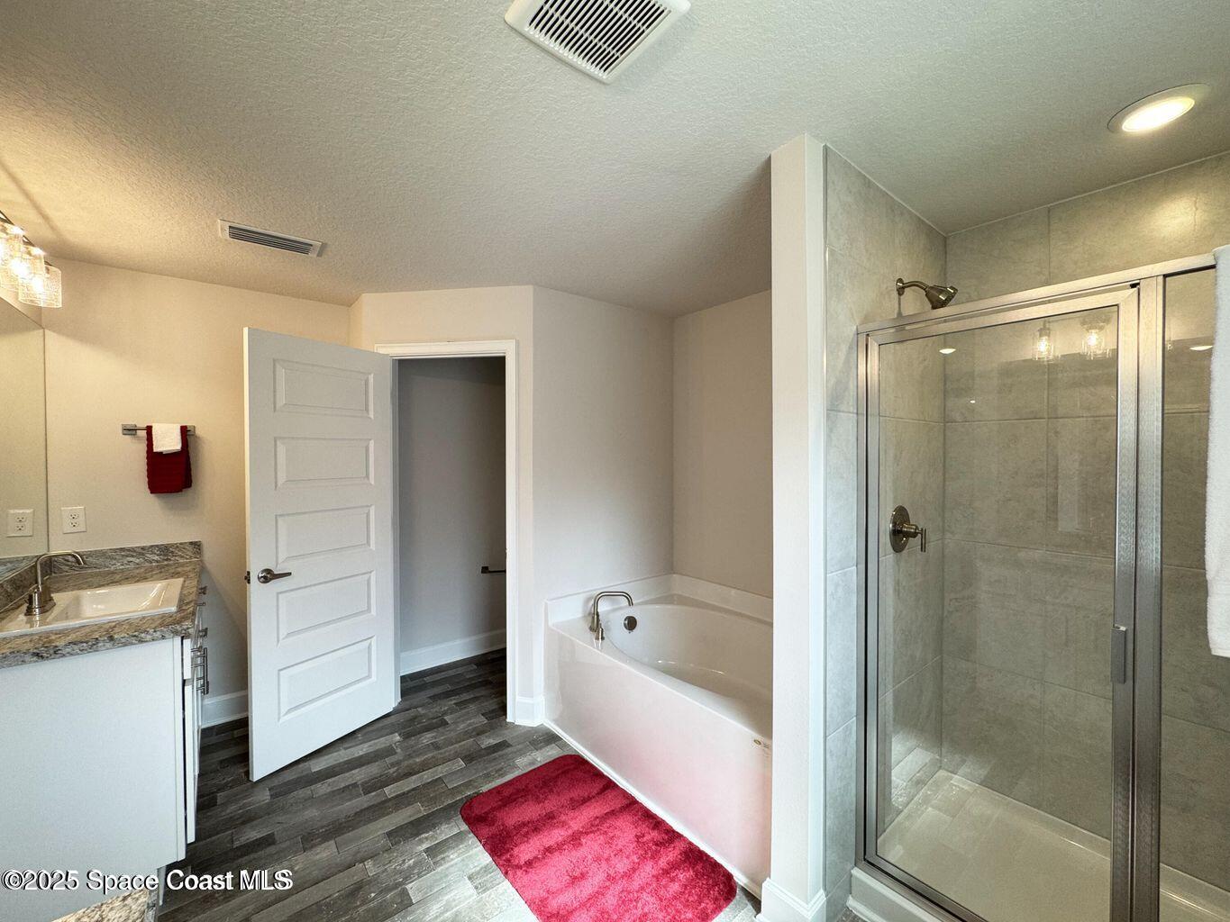 366 Faith Terrace Sebastian, FL 32958 - Photo 12 of 20 a bathroom with a shower and a bath tub