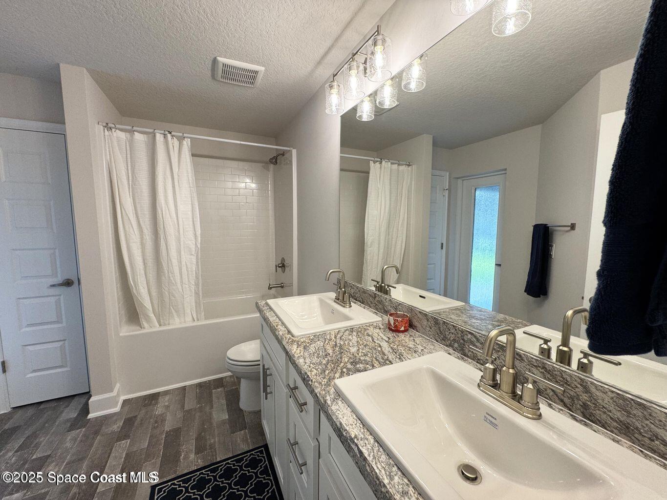 366 Faith Terrace Sebastian, FL 32958 - Photo 13 of 19 a bathroom with a double vanity sink and a mirror