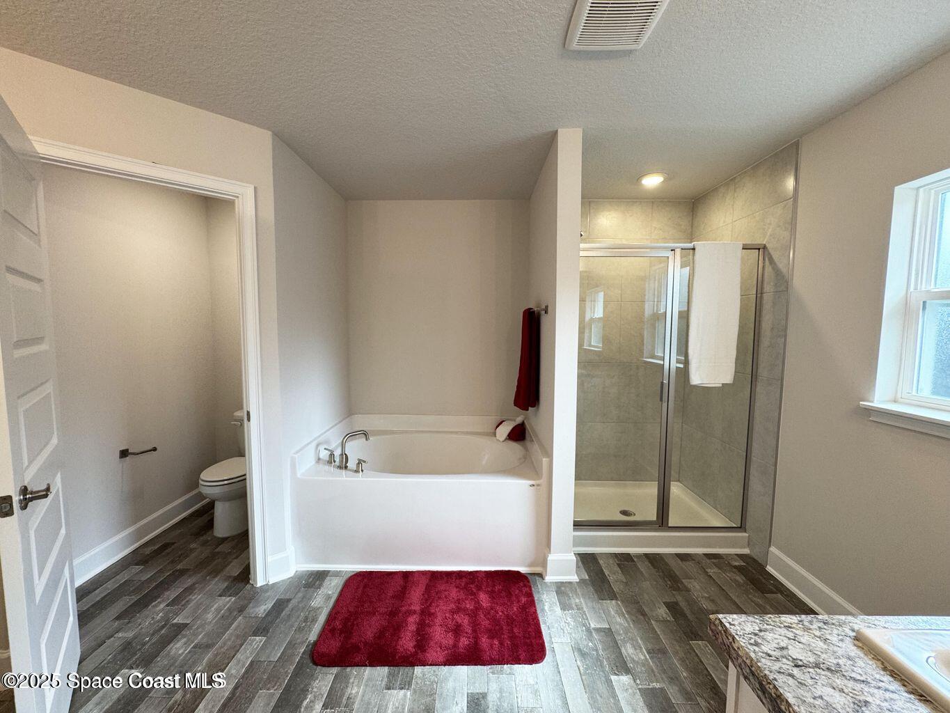 366 Faith Terrace Sebastian, FL 32958 - Photo 13 of 20 a bathroom with a tub shower vanity and a sink