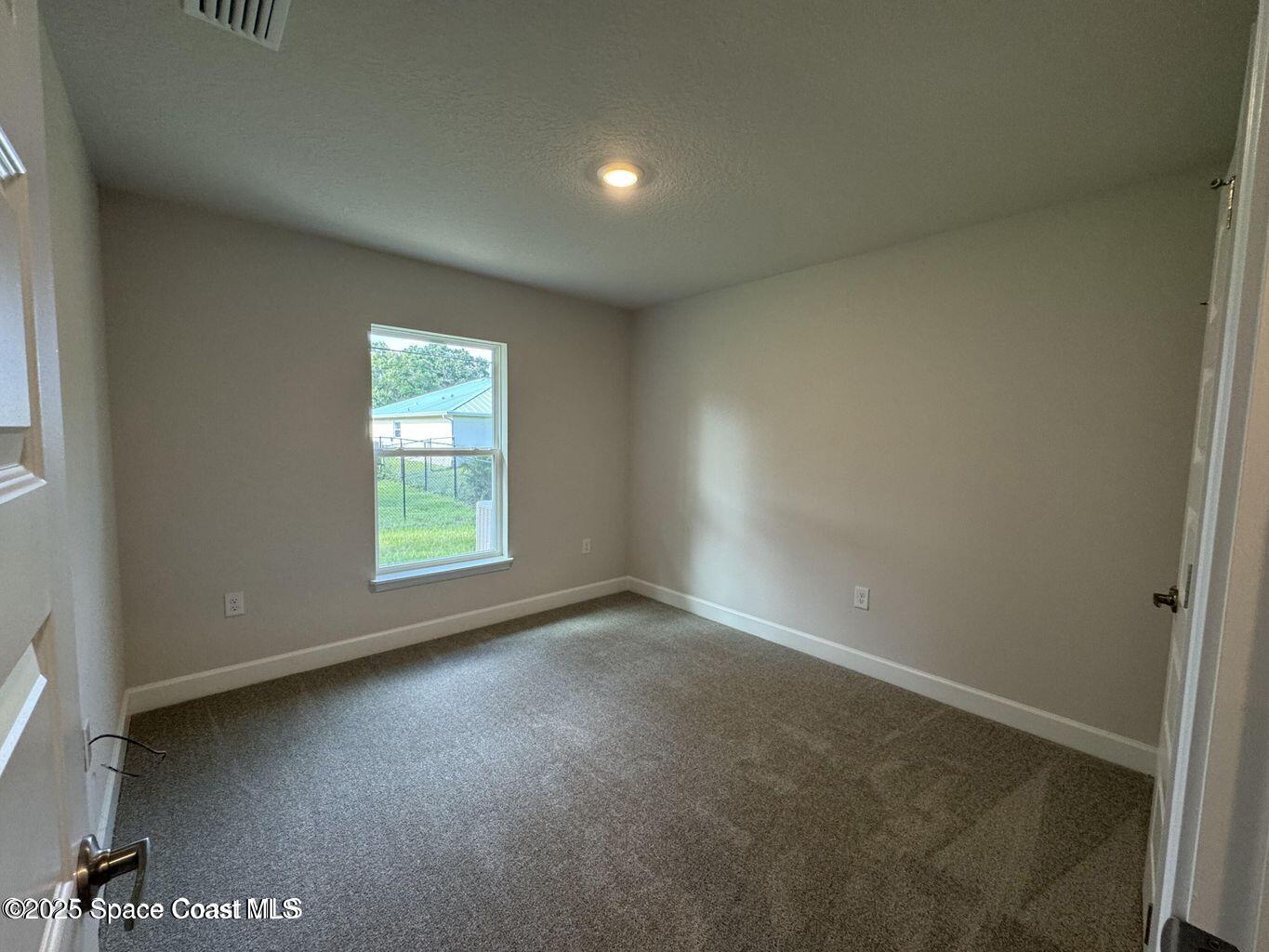 366 Faith Terrace Sebastian, FL 32958 - Photo 15 of 19 an empty room with a window