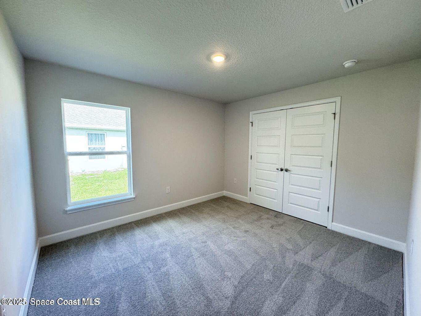 366 Faith Terrace Sebastian, FL 32958 - Photo 17 of 19 an empty room with a window