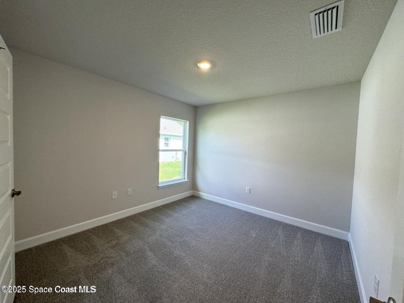 366 Faith Terrace Sebastian, FL 32958 - Photo 17 of 20 a view of an empty room with a window