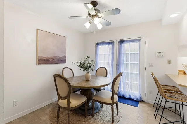 a dining room with furniture and window