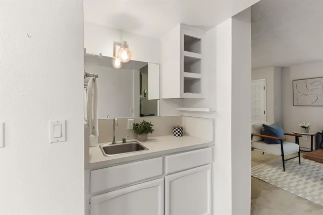 a bathroom with a sink and a mirror