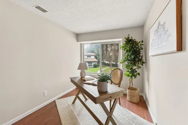 a view of a workspace with furniture