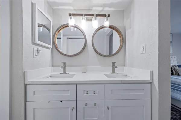 a bathroom with a sink and a mirror