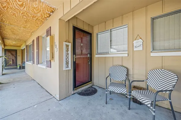 a view of livingroom with furniture and a window
