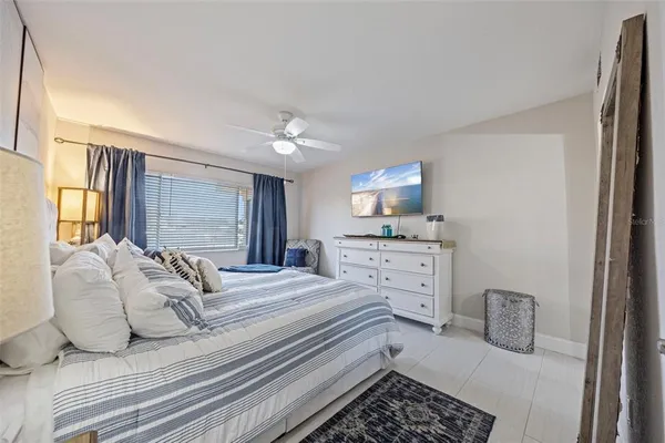 a bedroom with bed and window