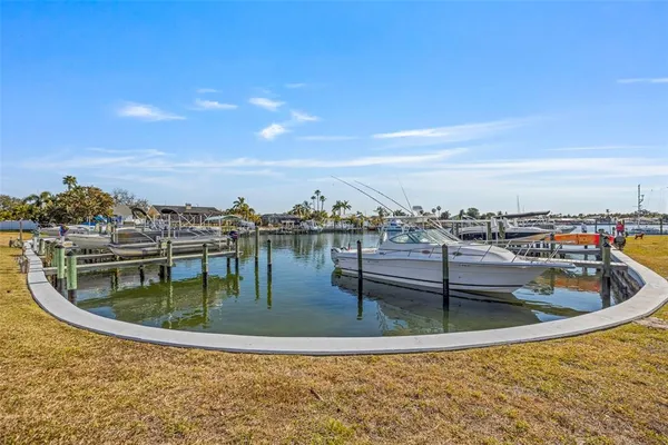 a view of a swimming pool with outdoor seating