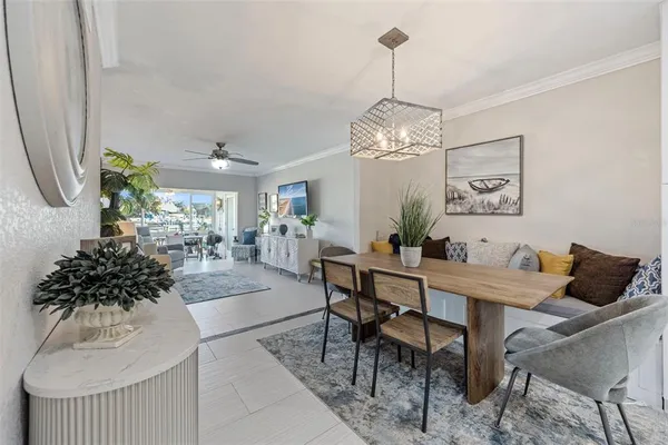 a view of a dining room with furniture and chandelier