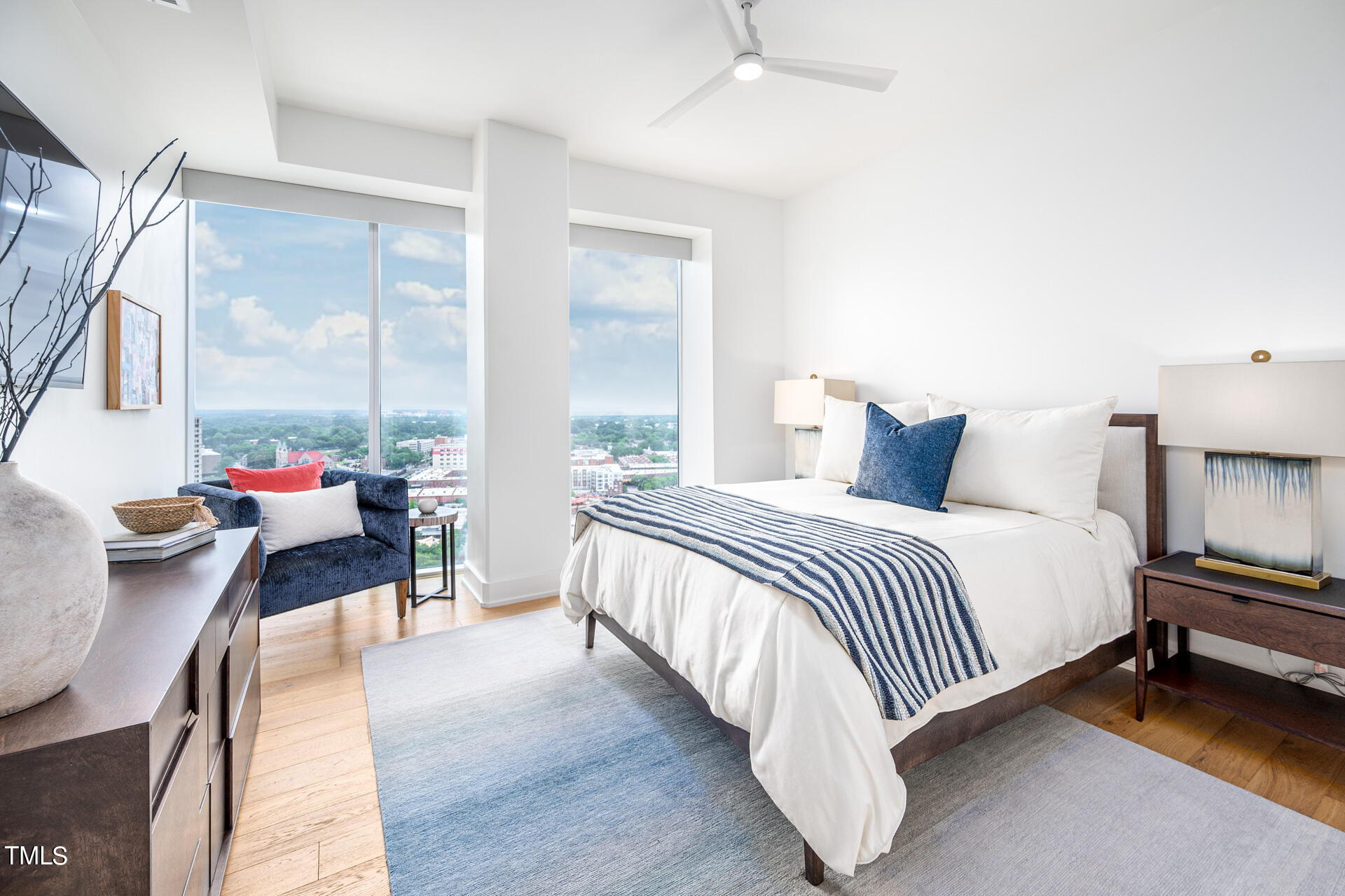 110 Corcoran Street, Unit 2301 Durham, NC 27701 - Photo 29 of 66 a bedroom with furniture and a large window