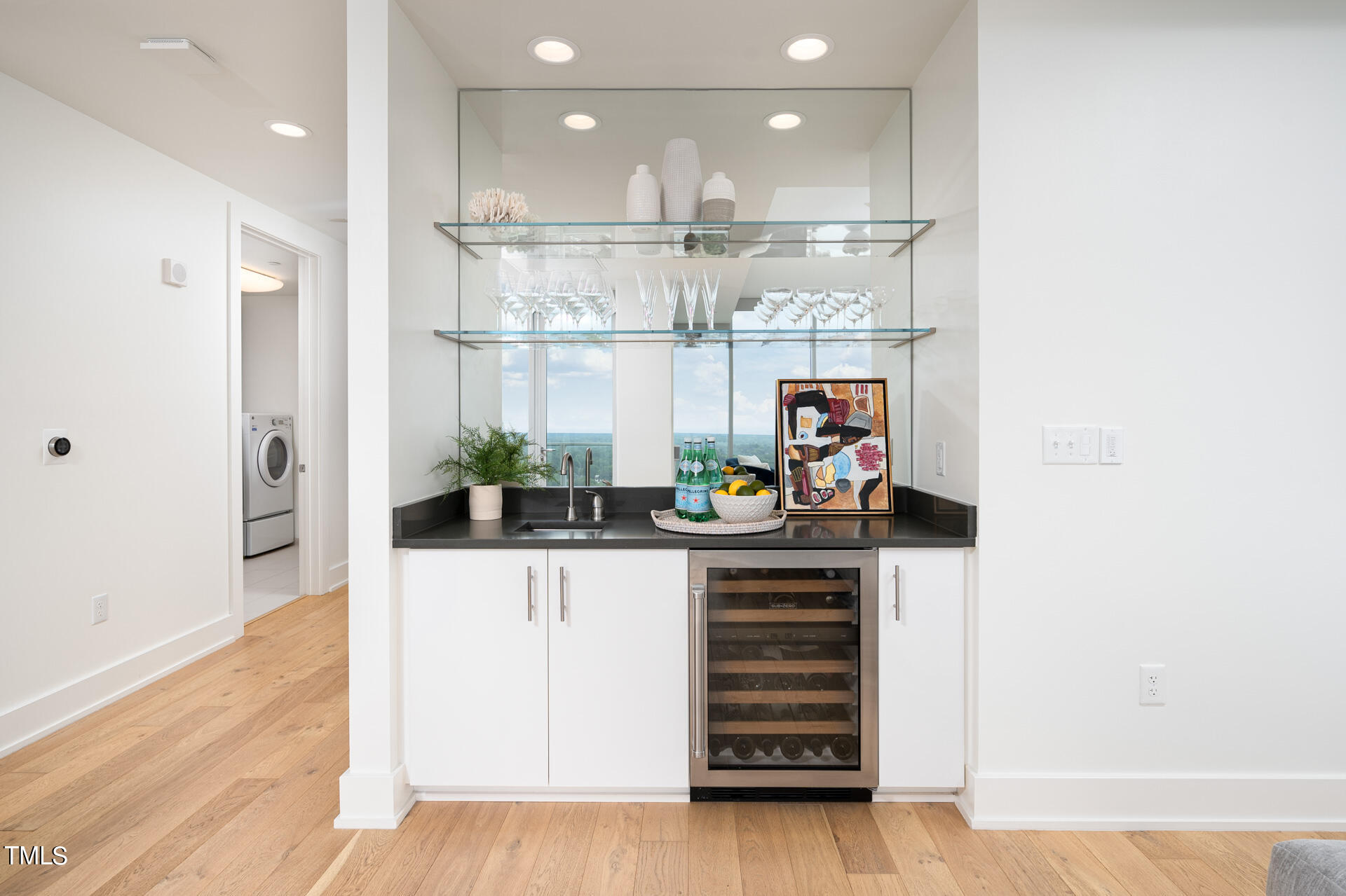 110 Corcoran Street, Unit 2301 Durham, NC 27701 - Photo 10 of 66 a kitchen with stainless steel appliances granite countertop a refrigerator and a wooden floor