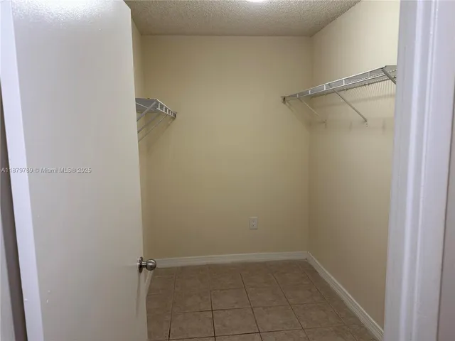 a bathroom with a toilet and a bath tub