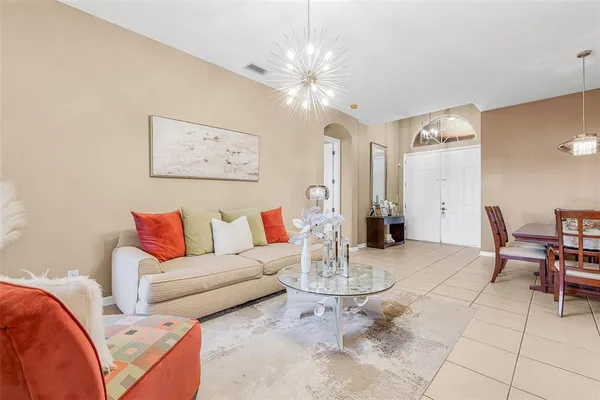 a living room with furniture and white walls